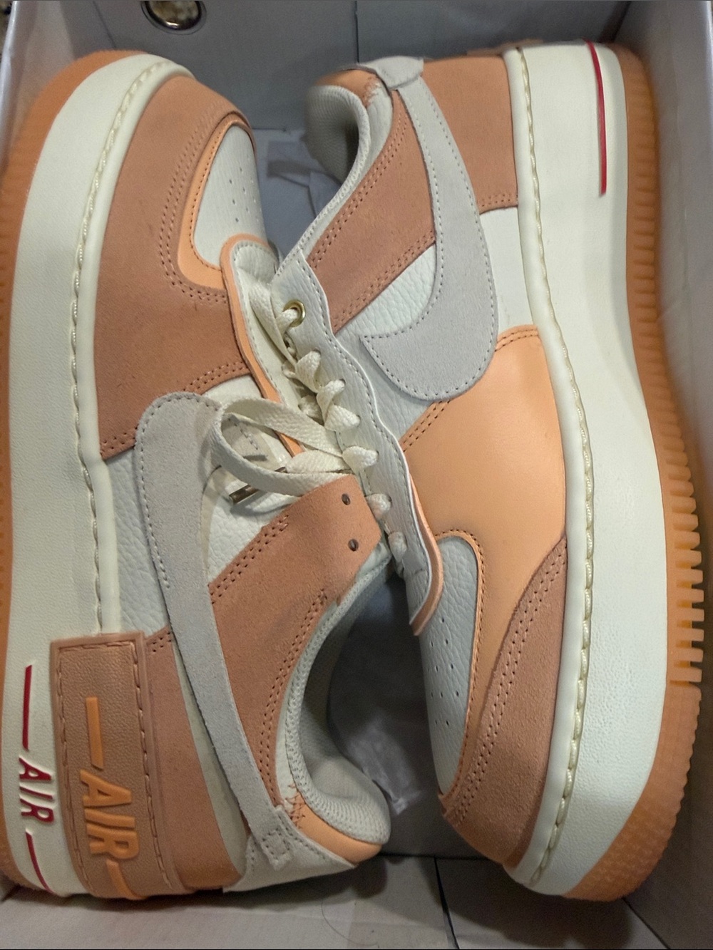 Nike women’s Low-Top Sneakers in Peach, Cream & White